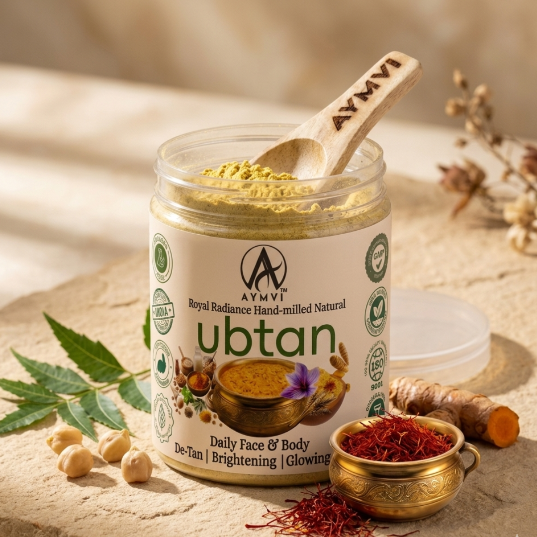 Revive your skin's natural radiance with AYMVÍ Royal Radiance Hand-milled Natural Ubtan. Packed with 100% active traditional herbs like Masur Dal, Saffron, and Turmeric, this chemical-free, waterless formula gently exfoliates, deeply cleanses, and de-tans for a healthy, glowing complexion on both your face and body.